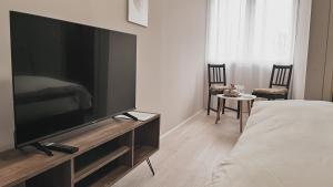 a living room with a large flat screen tv at Prenoćište Katarina JUGOVO in Smederevo
