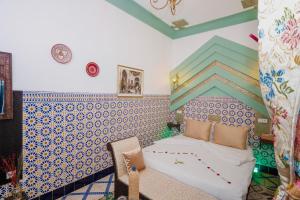 Postel nebo postele na pokoji v ubytování Riad Nouceiba Marrakech