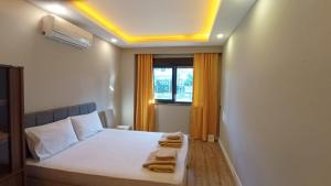 Postel nebo postele na pokoji v ubytování Mali Garden Residence