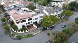 an aerial view of a city with a white house at Apartamento Heliconia - Casa Tartaruga Bogotá in Bogotá +14 photos