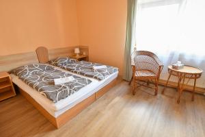Posteľ alebo postele v izbe v ubytovaní Apartmány Ados