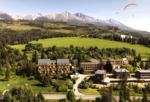 an aerial view of a resort with mountains in the background at AR TATRY Hills in Štrbské Pleso
