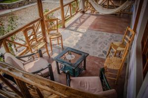 an overhead view of a room with chairs and a table at Casa Club El Pueblo Simbal in Trujillo