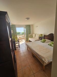 studio Le Palma, vue mer tesisinde bir odada yatak veya yataklar
