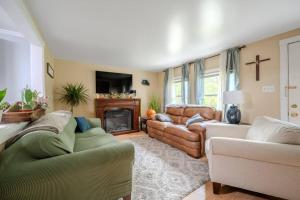 a living room with two couches and a fireplace at Belmont Lakeside Retreat in Belmont