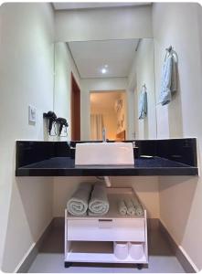 Ένα ή περισσότερα κρεβάτια σε δωμάτιο στο Studio Novo em Uberlândia