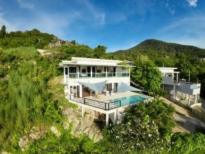 an aerial view of a house with a swimming pool at 4 bed rooms sea view villa with pool in Chaloklum