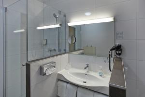 Een badkamer bij Hotel Sauerlacher Post