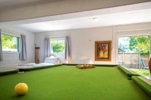a large living room with a pool table at Arrowtown Ambience in Arrowtown