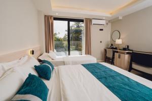 Postel nebo postele na pokoji v ubytování Ocean Pearl Fuvahmulah