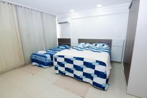 Ένα ή περισσότερα κρεβάτια σε δωμάτιο στο Manaus Sension 507