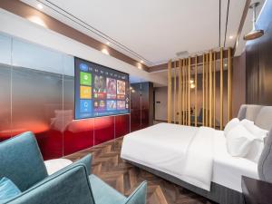 Voodi või voodid majutusasutuse TOWO Shangpin Hotel Xi'an - Xi'an Line 1 Kaiyuanmen Metro Station toas
