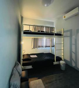 Кровать или кровати в номере Patone Hostel