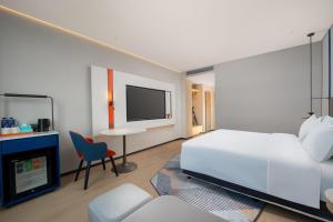 TV/Unterhaltungsangebot in der Unterkunft Holiday Inn Express Zhengzhou Nongye Road by IHG