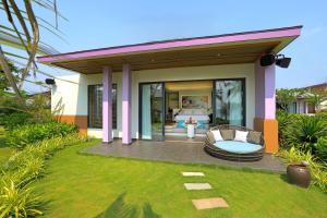 a villa with a pool and a patio at TTC Van Phong Bay Resort - Himalaya Sauna & Steam Retreat Included in Ninh Hòa