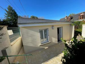 a small white house with a window on it at Gîte charmant à Montbazon avec terrasse, jardin et parking - FR-1-381-599 in Montbazon