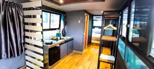 a room with a sink and a counter in an rv at Campod Resort @ Cameron Highlands in Cameron Highlands