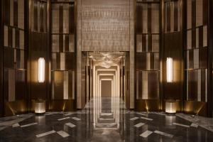 a hallway of a building with a door and lights at InterContinental Taichung by IHG in Taichung