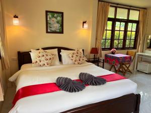 Un pat sau paturi într-o cameră la Krabi Discovery Resort +41 fotografii