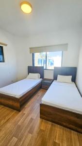 Postel nebo postele na pokoji v ubytování Beachside Hideaway Apartment, 200m to the Havana Beach