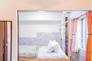 Ένα ή περισσότερα κρεβάτια σε δωμάτιο στο CLASSE TROIS