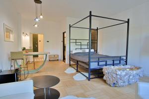 a room with a bed and a table in it at Art Boutique Residence in Bucharest