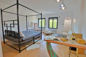 a bedroom with a bed and a desk with a table at Art Boutique Residence in Bucharest +85 photos