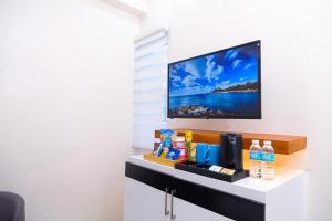 TV a/nebo společenská místnost v ubytování Le Dream Hotel near Vigan