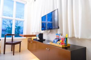 TV a/nebo společenská místnost v ubytování Le Dream Hotel near Vigan