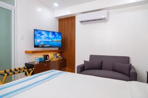 TV a/nebo společenská místnost v ubytování Le Dream Hotel near Vigan