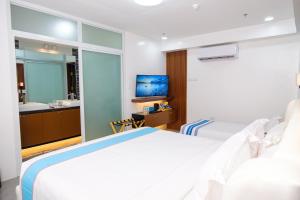 TV a/nebo společenská místnost v ubytování Le Dream Hotel near Vigan