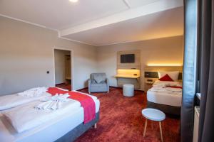 Postel nebo postele na pokoji v ubytování Hotel Lengenfelder Hof