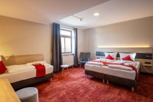 Postel nebo postele na pokoji v ubytování Hotel Lengenfelder Hof