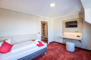 Postel nebo postele na pokoji v ubytování Hotel Lengenfelder Hof