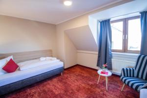 Postel nebo postele na pokoji v ubytování Hotel Lengenfelder Hof