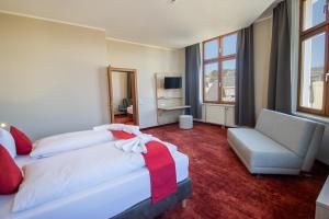 Postel nebo postele na pokoji v ubytování Hotel Lengenfelder Hof
