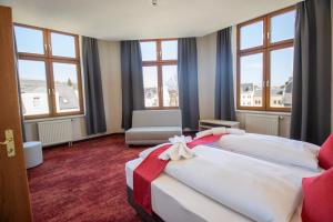 Postel nebo postele na pokoji v ubytování Hotel Lengenfelder Hof