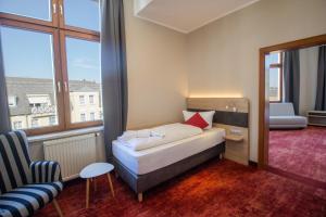 Postel nebo postele na pokoji v ubytování Hotel Lengenfelder Hof