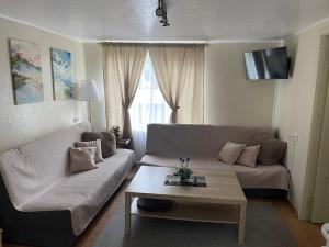 Posezení v ubytování Privatus namelis Jūros g. 61