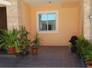 a room with a window and a bunch of plants at 2 Storey house, 2BR, 2CR Fully Furnished house in Consolacion
