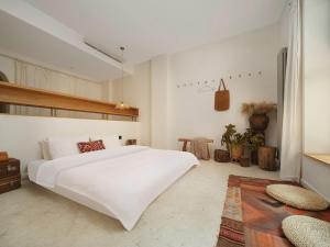 Voodi või voodid majutusasutuse YiXi Designe Hotel - Xi'an Bell Tower & Ming City Wall & T'ang Dynasty Ever-Bright City toas