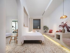 Voodi või voodid majutusasutuse YiXi Designe Hotel - Xi'an Bell Tower & Ming City Wall & T'ang Dynasty Ever-Bright City toas