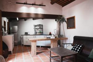 a kitchen with a wooden table in a room at 牧嶼 Nomads' Isle in Jinhu