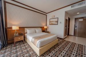 Ein Bett oder Betten in einem Zimmer der Unterkunft Adya Hotel Langkawi