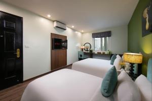 Voodi või voodid majutusasutuse Anise Hotel & Spa Hanoi toas