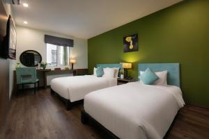 Voodi või voodid majutusasutuse Anise Hotel & Spa Hanoi toas