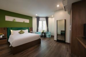 Voodi või voodid majutusasutuse Anise Hotel & Spa Hanoi toas