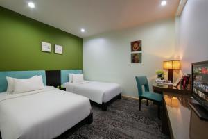 Voodi või voodid majutusasutuse Anise Hotel & Spa Hanoi toas