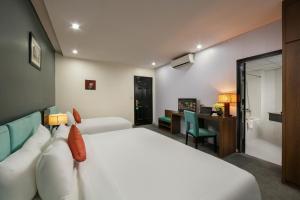 Voodi või voodid majutusasutuse Anise Hotel & Spa Hanoi toas