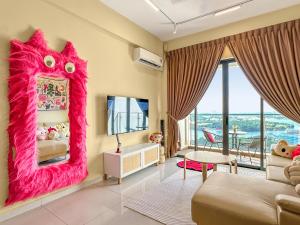 a living room with a large pink dragon mirror at FunxVivid Seaview 2BR 2CP near SG CIQ KSL ZooJB Free Netflix WiFI in Johor Bahru